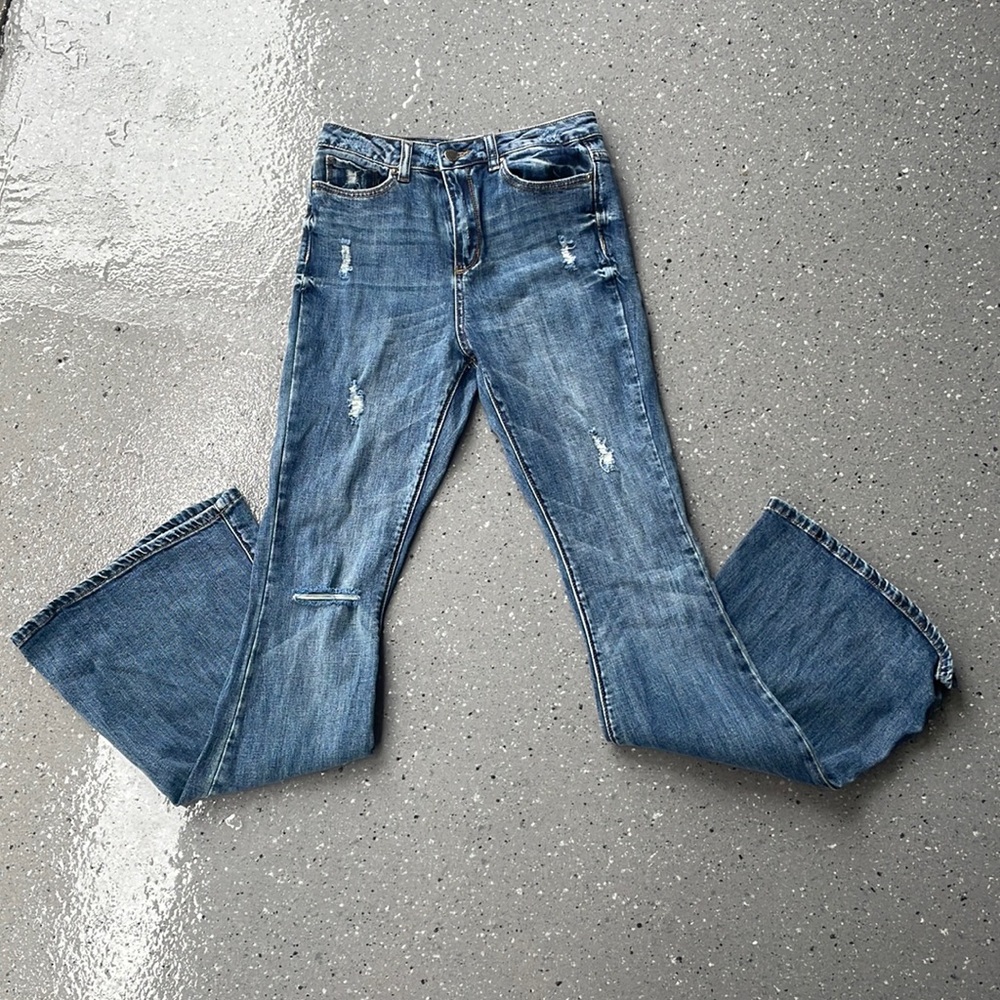 Distressed flare denim jeans